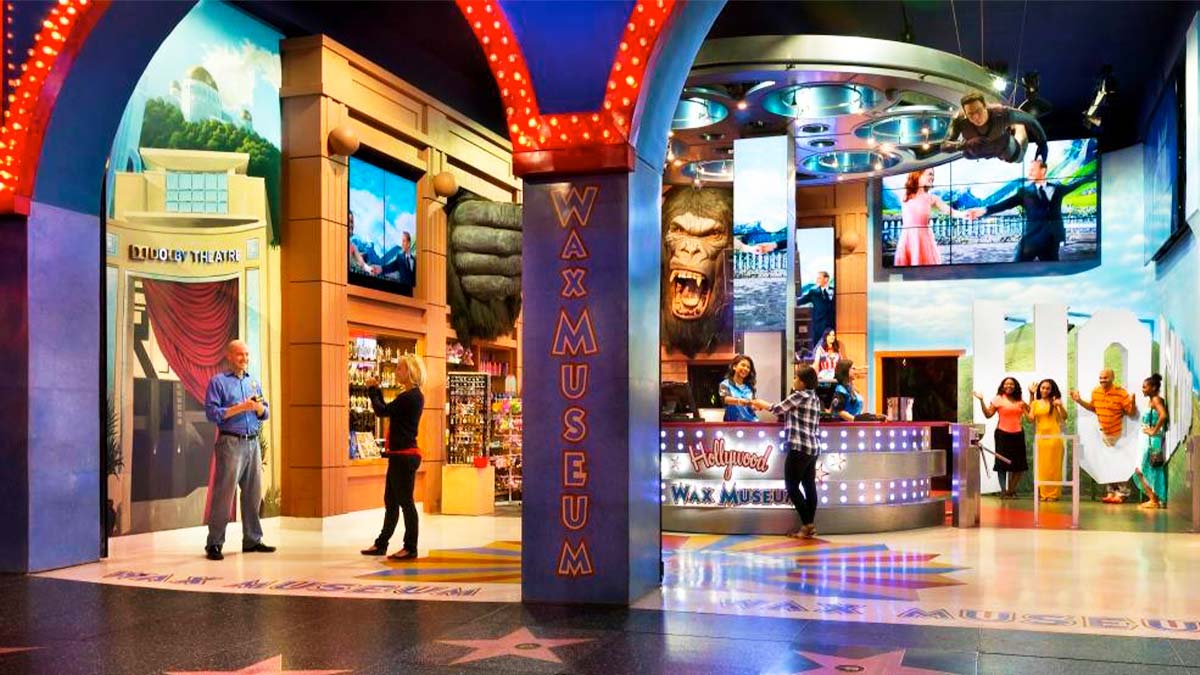 A photo inside the museum shows a couple taking pictures on the left side, two staff assisting customers and four other tourists enjoying the place.